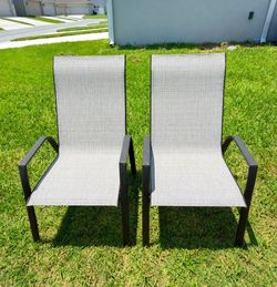 Selling 2 brown outdoor patio chairs.