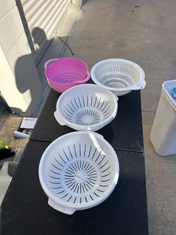 Four plastic strainers one has small crack on bottom five dollars for all