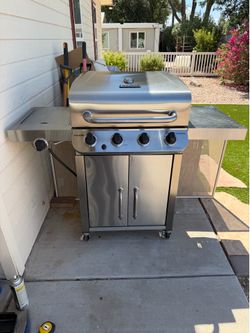 This is a Char-Broil Performance Series 4-burner stainless steel liquid propane gas grill with a side burner.