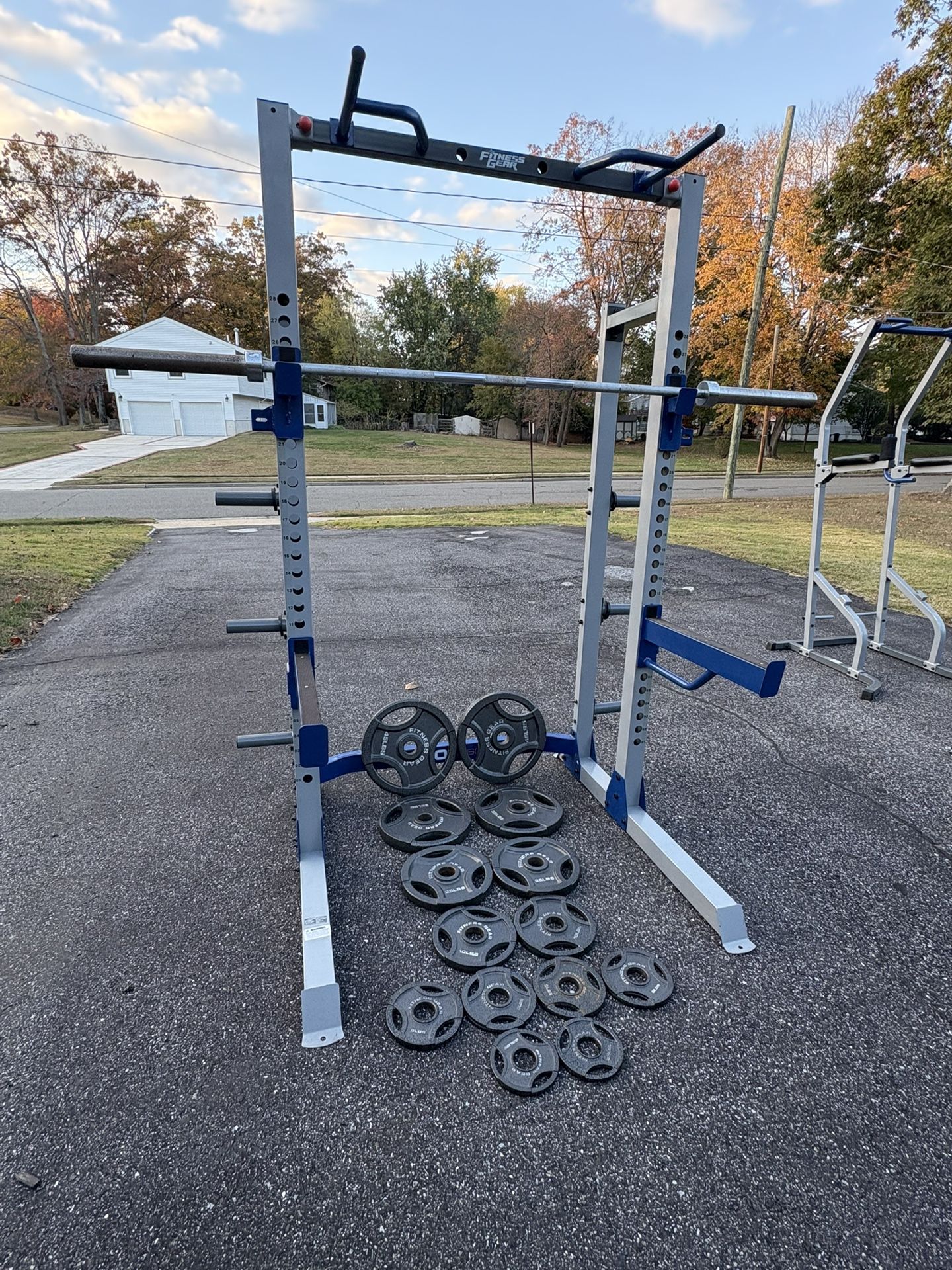 Power Rack With Olympic Weights And Barbell