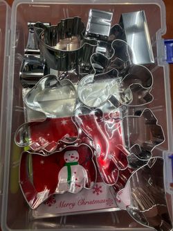 Holiday baking set. It features heavy-duty stainless steel cookie cutters organized inside a clear snap-lock storage container.