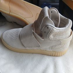 beige Adidas Tubular Invader Strap sneakers. 

