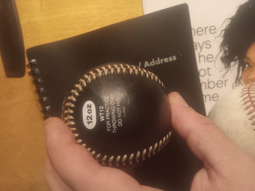12 Oz Weighted Baseball And Then Two Regular Baseballs