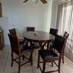 7 Pc counter height Oval Dining table 6 vegan leather chairs