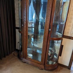 Antique Curio Cabinet With Curved Glass And Interior Lights