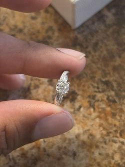 a 0.70 carat Round D VS1 diamond and a 14K White Gold Pave Rope Engagement Ring