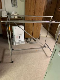 Double sided clothing rack on wheels - very sturdy and adjustable heights