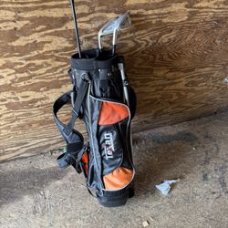 Texan Classics Jr Golf Bag 4 Way 4 Pockets Stan with 3 used golf clubs.  Will add another bag for $25 extra if you want. (Look on page 