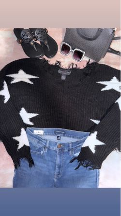 Distressed cropped sweater.