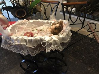 Porcelain doll in carriage