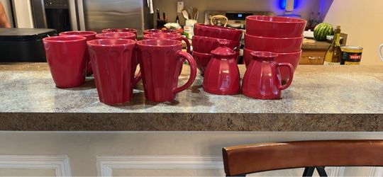 Kitchenware includes red mugs & bowls