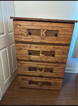 Rustic Wood 4-Drawer Dresser with Carved Details