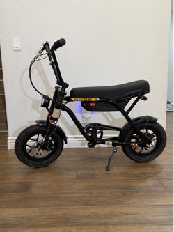 Schwinn Hurricane compact electric bike in black with 14-inch wheels. $450 no less