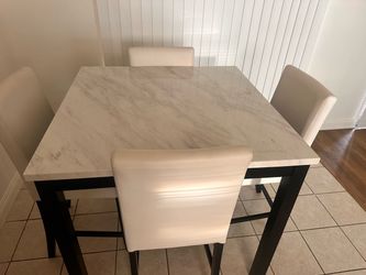 white marble-look tabletop with black legs
