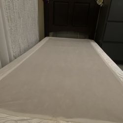 Twin Bed with wheels on front, with box spring