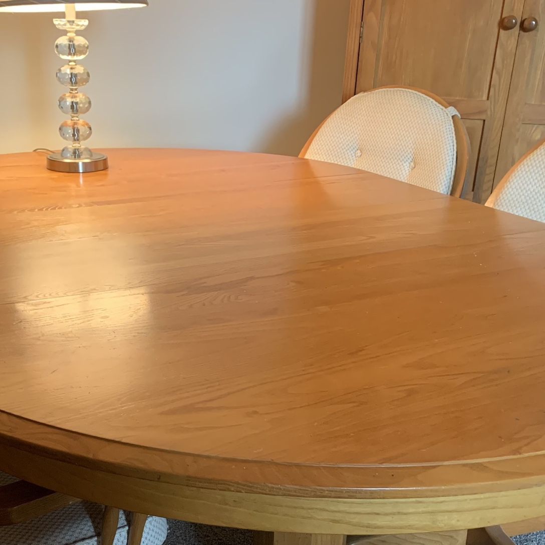 Oak table with Padded Swivel Wheeled Chairs