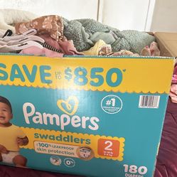 box of baby girl clothes 