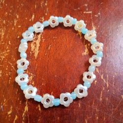White Flowers Blue Beaded. Bracelet 