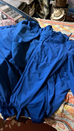 Royal blue medical scrubs.  Mostly LG size a couple XL .   In good condition the hospital changed colors so I have to do away with them.
