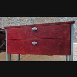 Gorgeous matching set of two cherry mahogany wooden end tables. Both pieces are heavy, well-constructed, and feature deep storage drawers with decorat