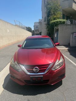 2017 Red Nissan Altima Sedan