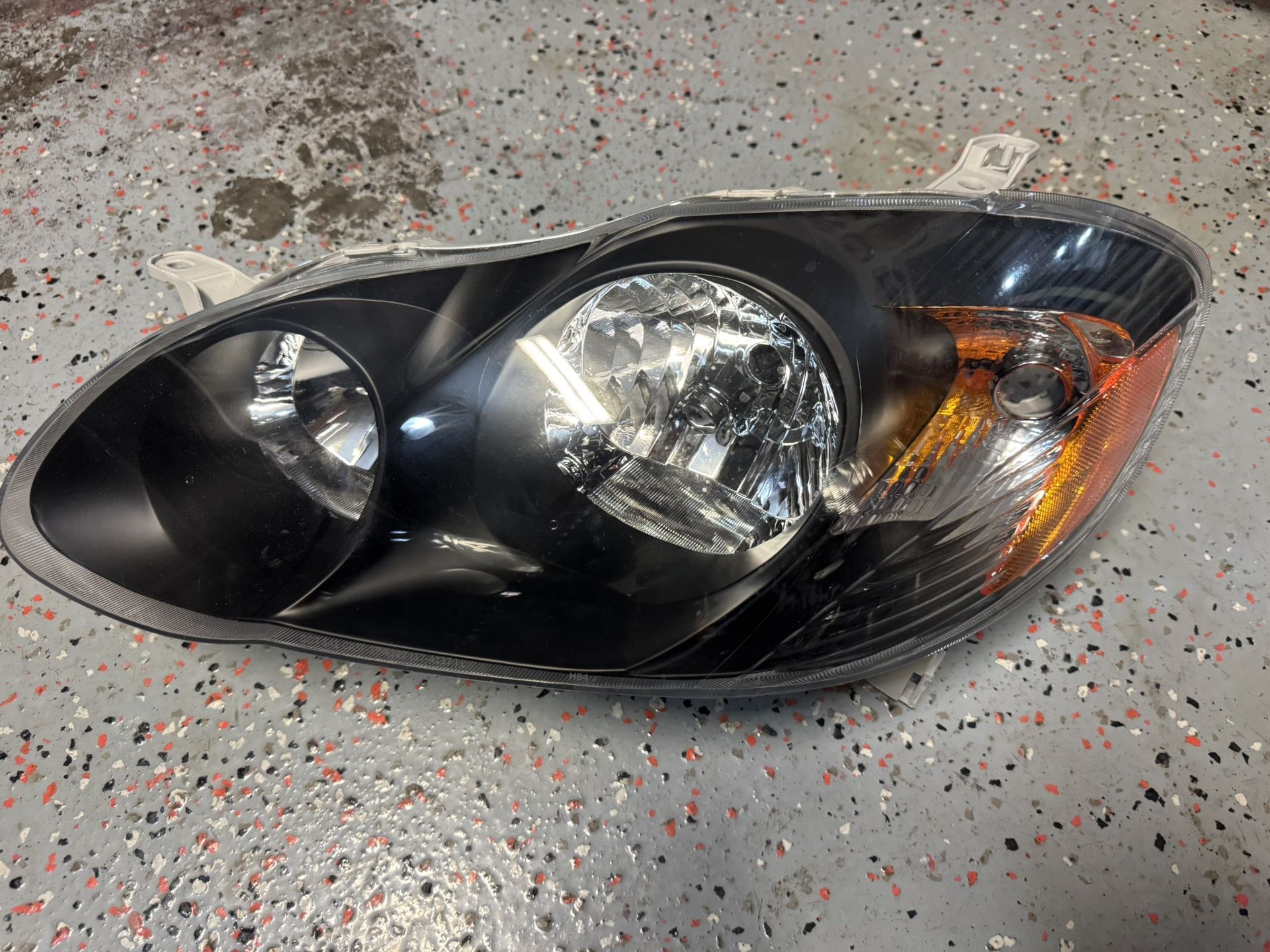 Toyota Corolla Left Headlight Black Mask Driver Side