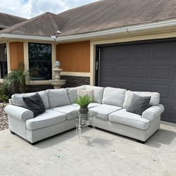 Beautiful lite grey sectional in great condition very comfortable and clean asking 680