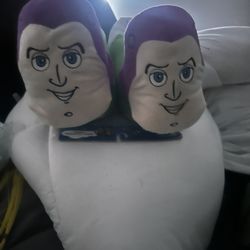 New Disney Pixar Toy Story Buzz Lightyear plush slippers are an adult size large. These slippers are made of 100% polyester material and have a green,