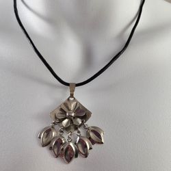  Silverd Toned  Dangle Pendant On Black Rope.