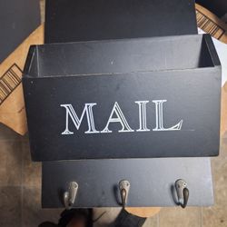 10" X 33" X 14" WOODEN MAIL BIN WITH HOOKS.