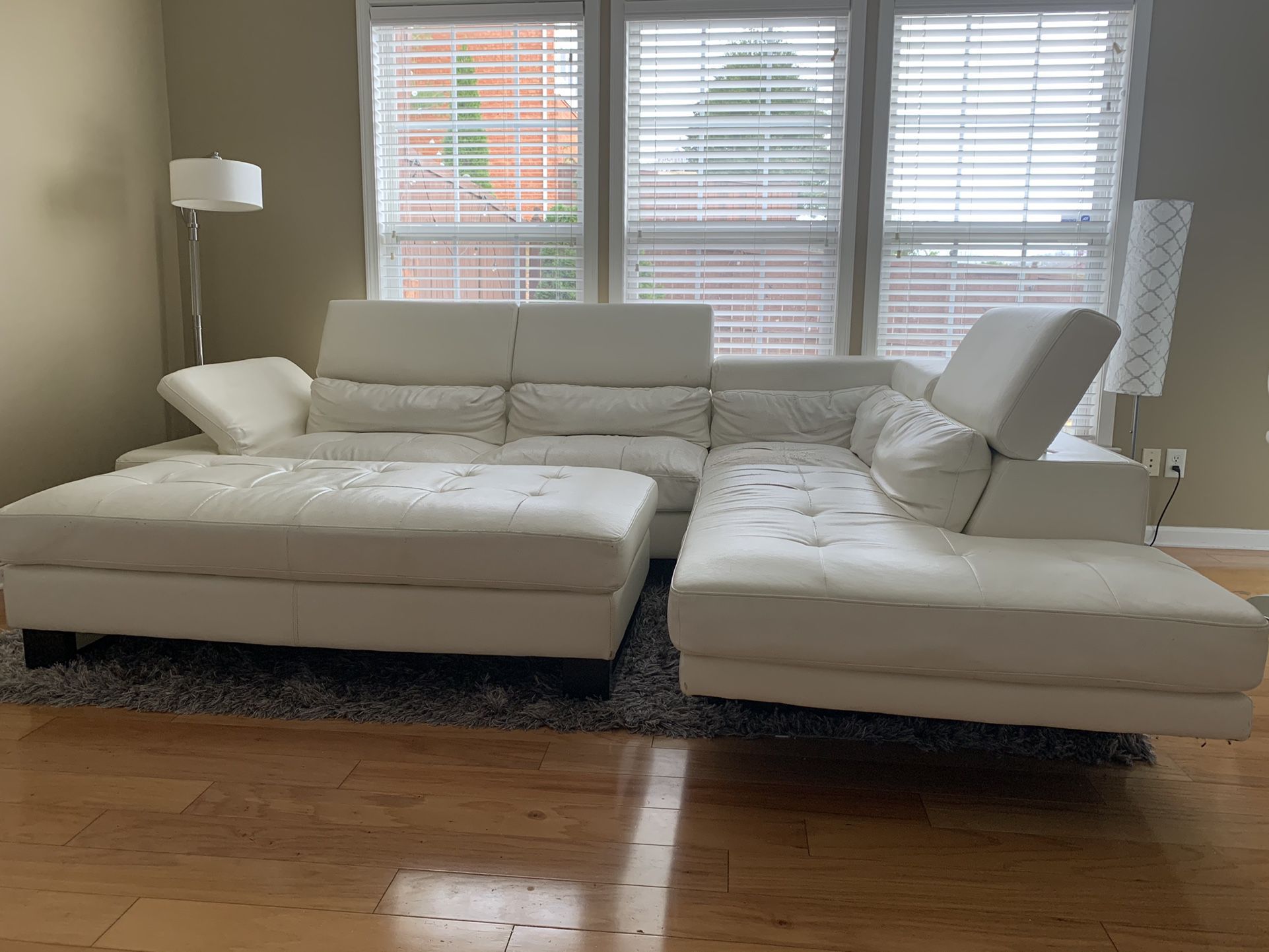 White Leather Sectional Sofa, Ottoman And Grey Rug