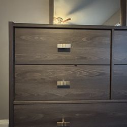 Brown dresser with mirror