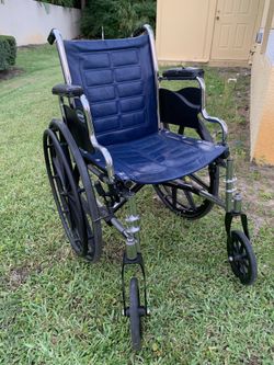 Wheel chair And Extra Leg Rests