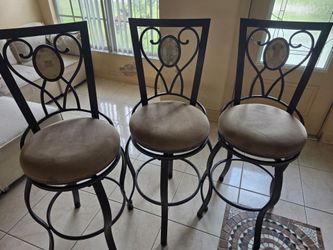 3 high top swirling chairs