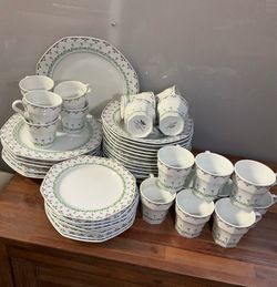 48-piece octagonal porcelain dinnerware set with a floral rim