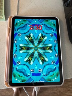 Blue Apple iPad and Pencil
