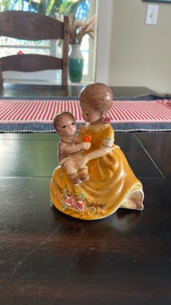 Antique girl holding baby