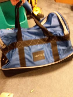 27 in Long by 14 and a half wide by 17 deep roller duffle bag