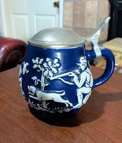 Vintage German Gerz blue background with white raised relief hunting scene stoneware beer stein