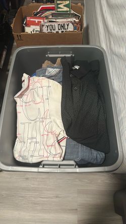 Tub of men’s clothes and shoes