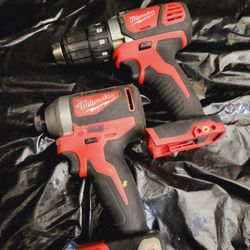 Milwaukee M18 18V Lithium-Ion Brushless Cordless 1/4 in. Impact Driver and compact drill.