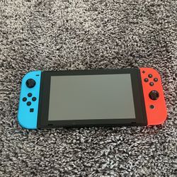 Used Nintendo Switch + Holding case, accessories, and 3 games