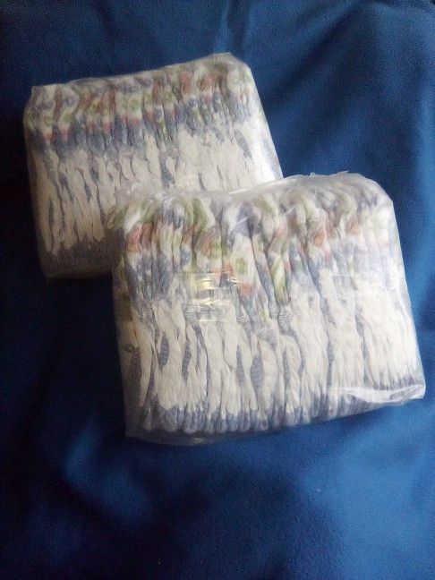 2 Packs Of Pampers Diapers 