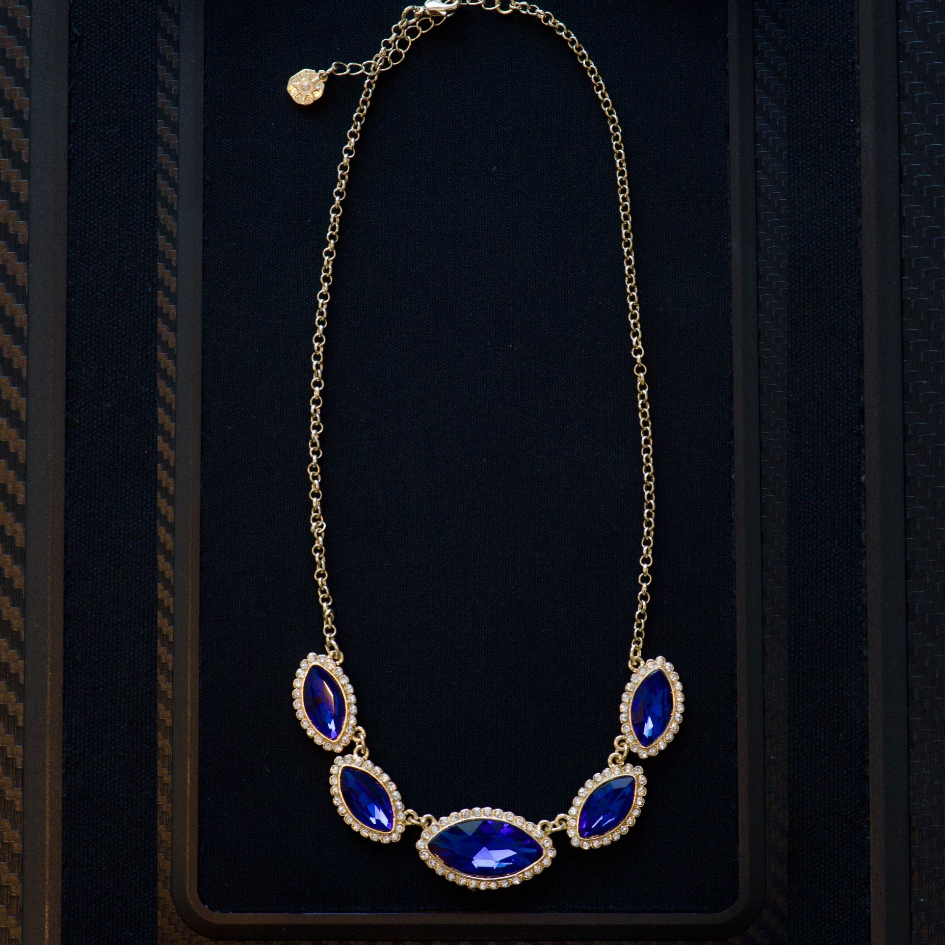 Elegant Gold Necklace with Deep Blue Gemstones and Diamond Accents