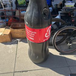 Coca cola bottle shaped recycle bin or trash can 