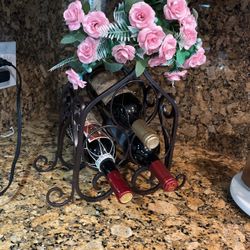 Wrought Iron Wine Rack With Artificial Flowers Include, $15
