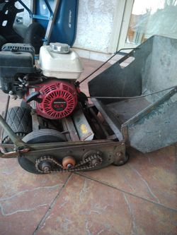 Old school lawn mower with a newer Honda engine