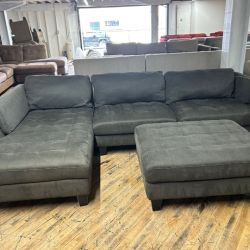 Delivery Available Ashley furniture dark gray sectional couch with ottoman