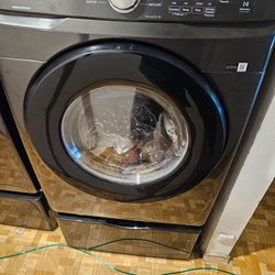 Samsung washer dryer combo, like new, with two 27 inch pedestals. Like new