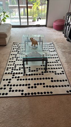 Glass coffee table and rug
